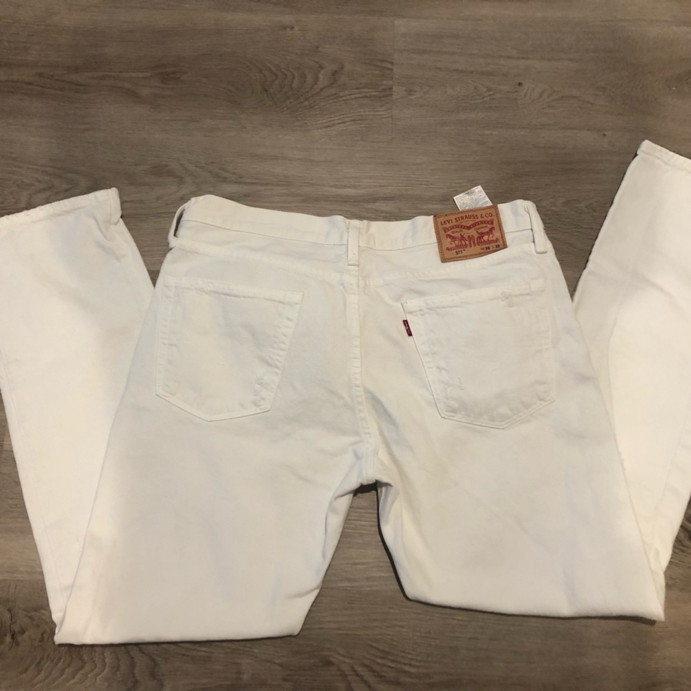 Levi’s 511 36x32 white distressed jeans.